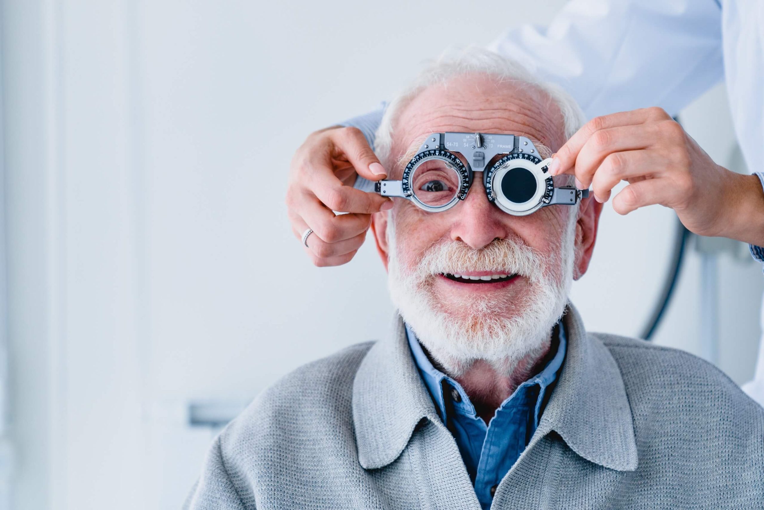 Older man having his eyes examined by an optometrist